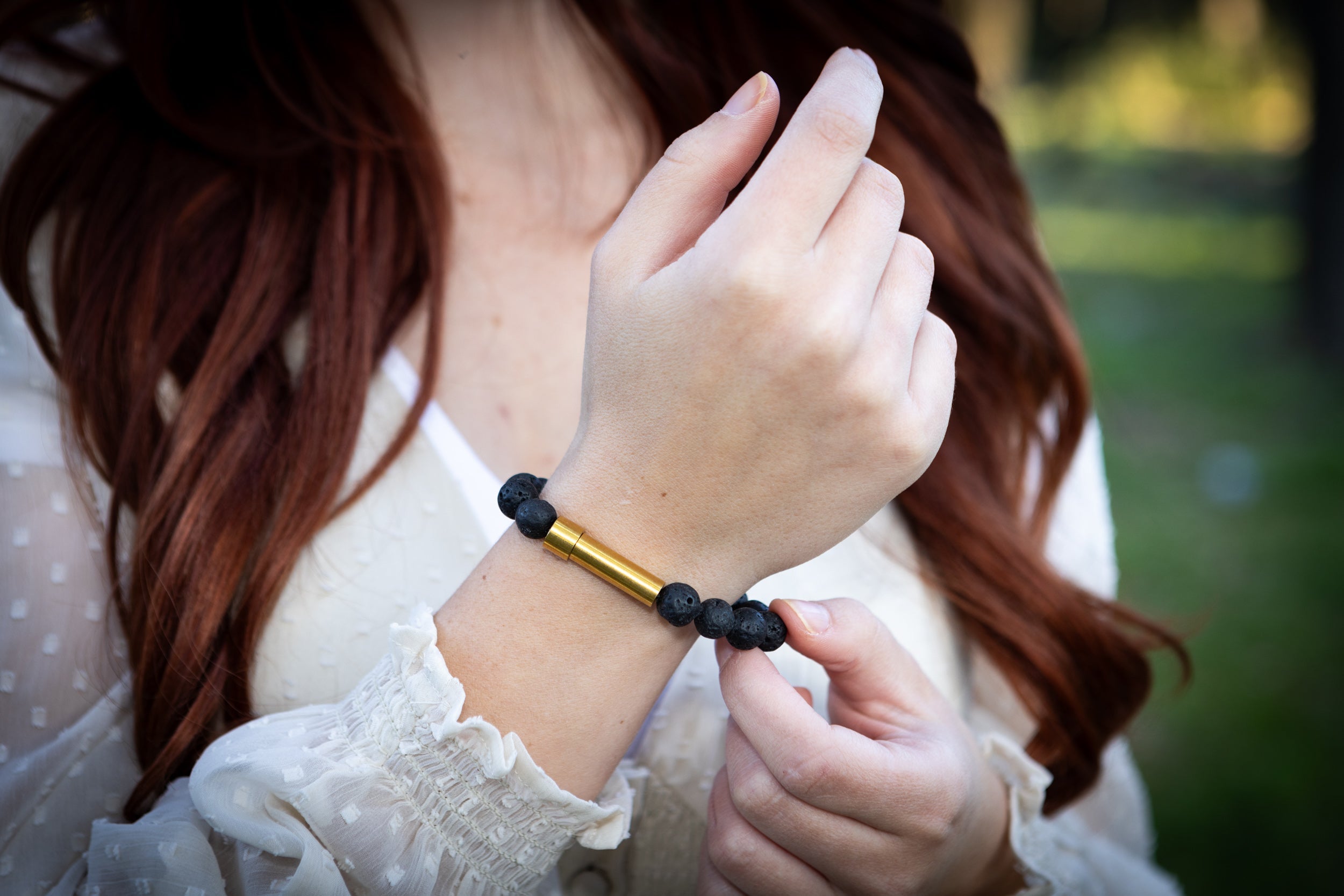 Silver cremation jewelry bracelet with black lava stones, designed for fur or ashes, by Spirit Pieces.