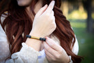 Silver cremation jewelry bracelet with black lava stones, designed for fur or ashes, by Spirit Pieces.