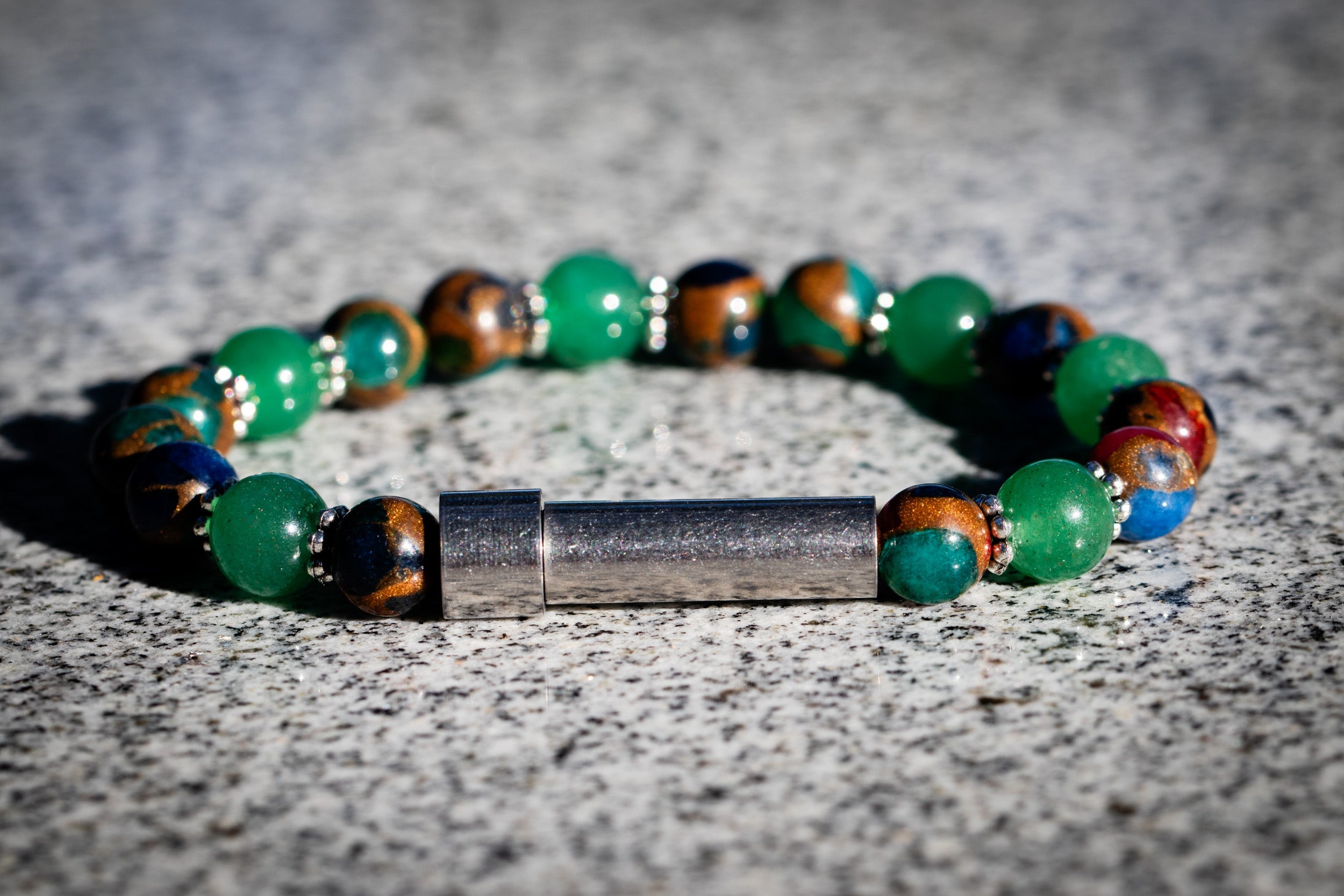 Silver cremation jewelry bracelet with mosaic jasper and aventurine, designed for hair, fur, or ash keepsake.