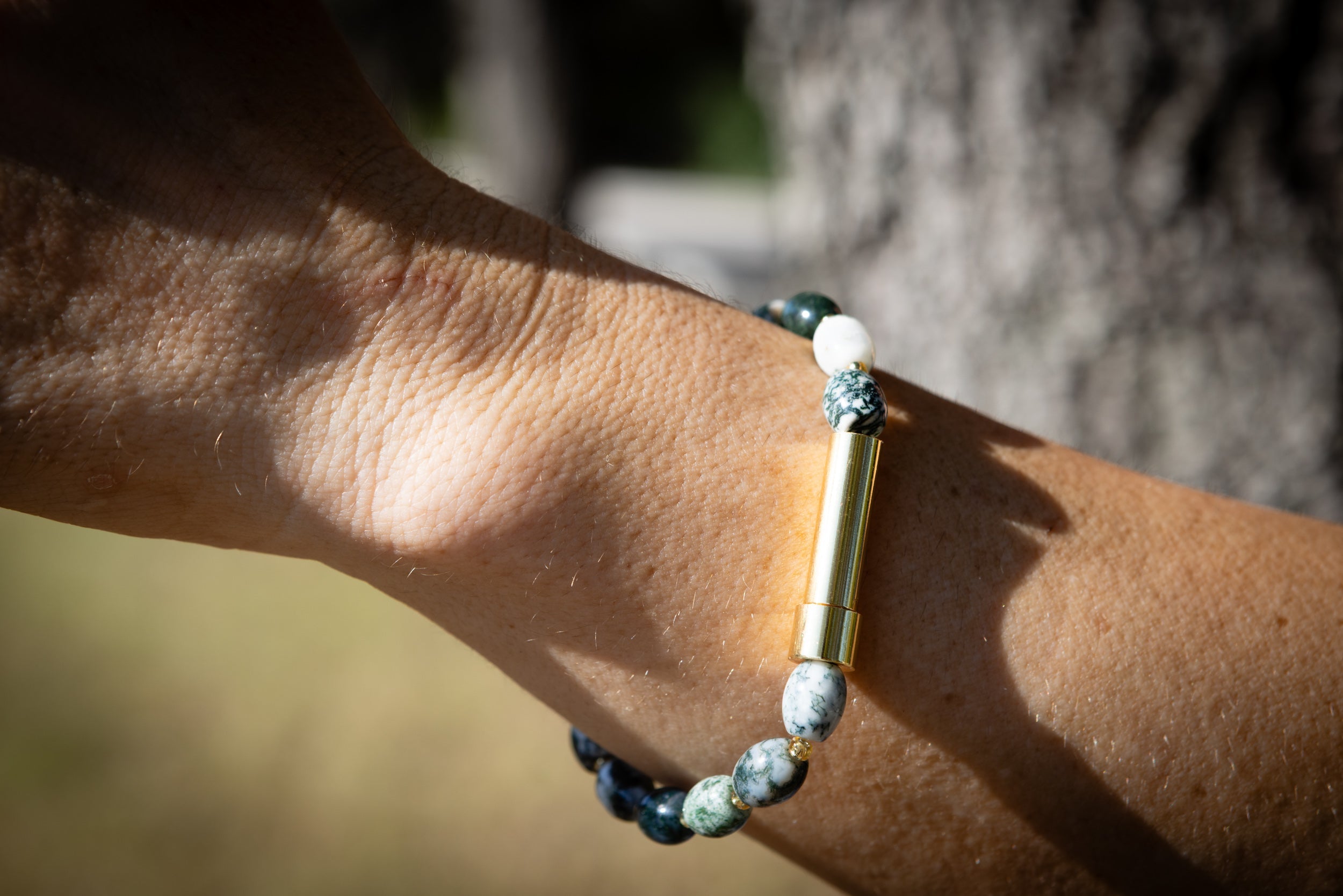 Spirit Pieces Moss Agate barrel cremation jewelry bracelet for hair, fur, or ash, featuring silver design and natural stone details.