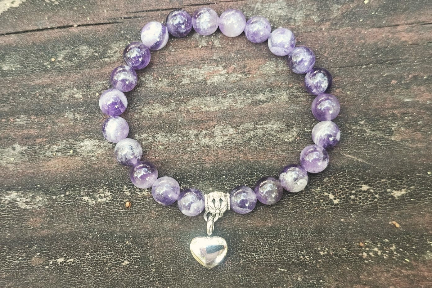 Silver Dogtooth Amethyst Urn Bracelet by Spirit Pieces, cremation jewelry bracelet with purple gemstone and delicate design.