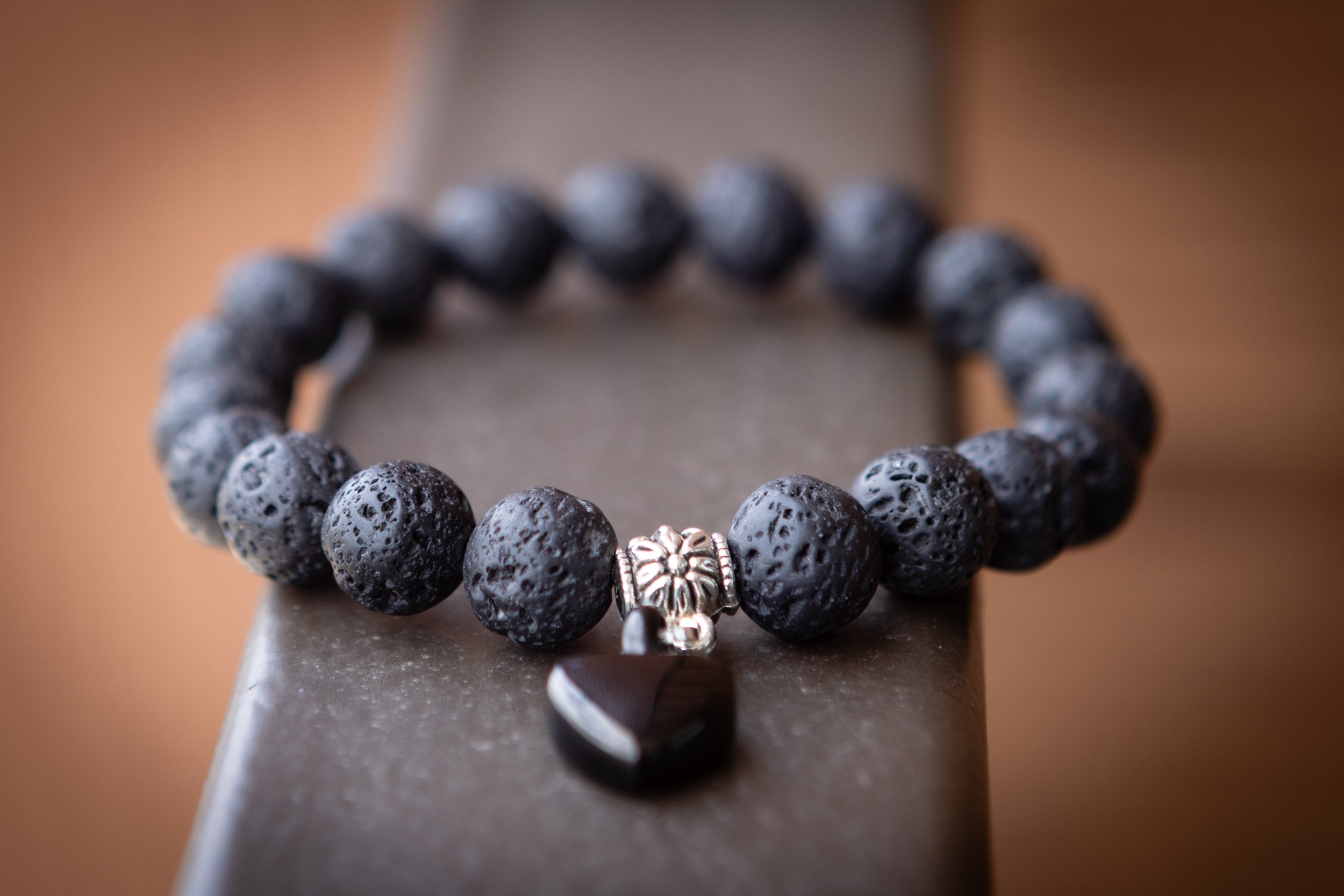 Silver Lava Stone Keepsake Urn Bracelet by Spirit Pieces, cremation jewelry with a petite design for filling at home, featuring natural lava stones.