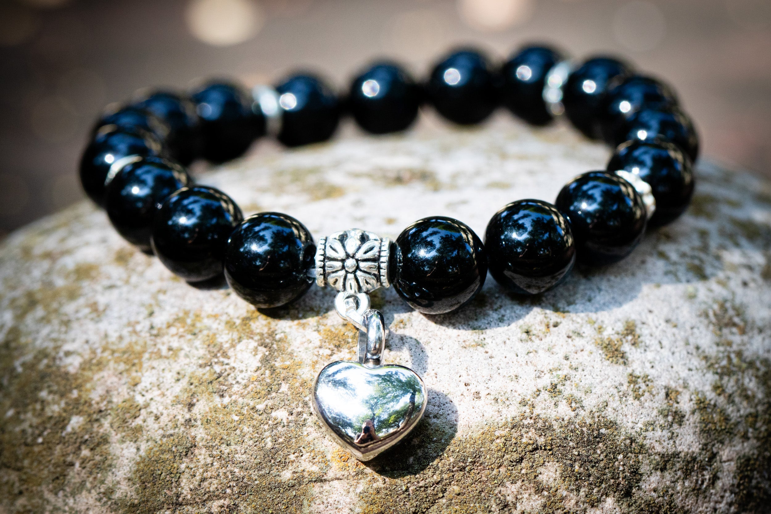 Silver Onyx Keepsake Urn Heart Bracelet by Spirit Pieces, cremation jewelry bracelet with a heart-shaped design and engraved details.