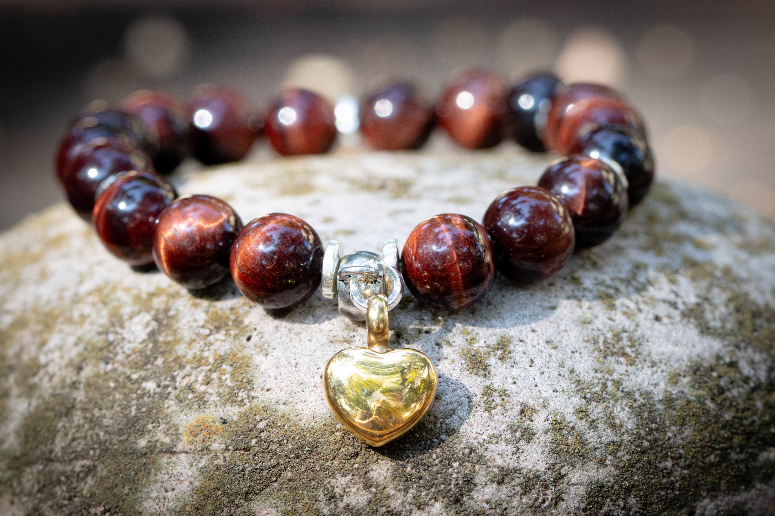 Red Tiger Eye keepsake urn heart bracelet in silver, cremation jewelry bracelet with a heart-shaped design by Spirit Pieces.