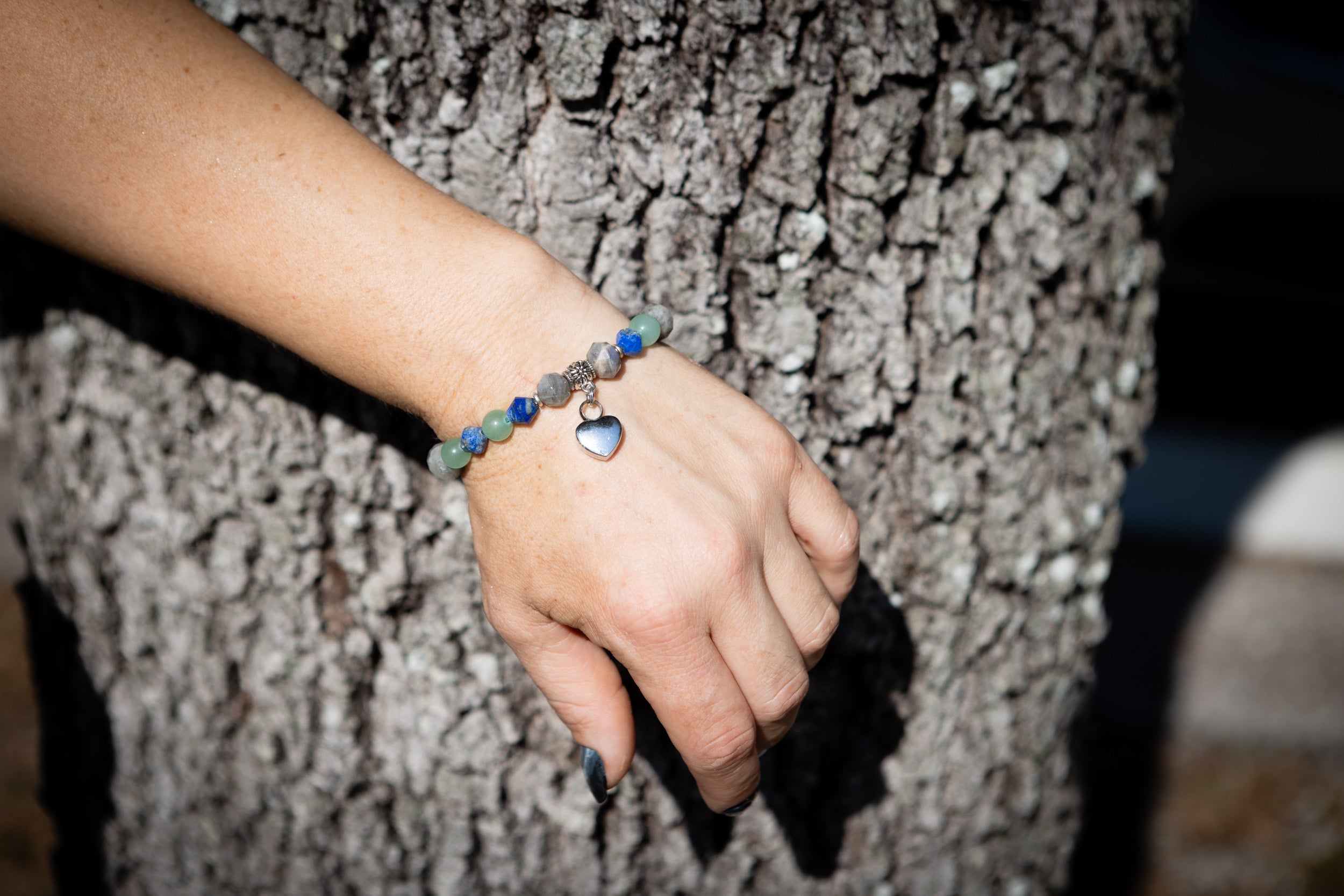 Silver cremation jewelry bracelet with sodalite, labradorite, and aventurine beads, designed for keepsake urn filling at home.
