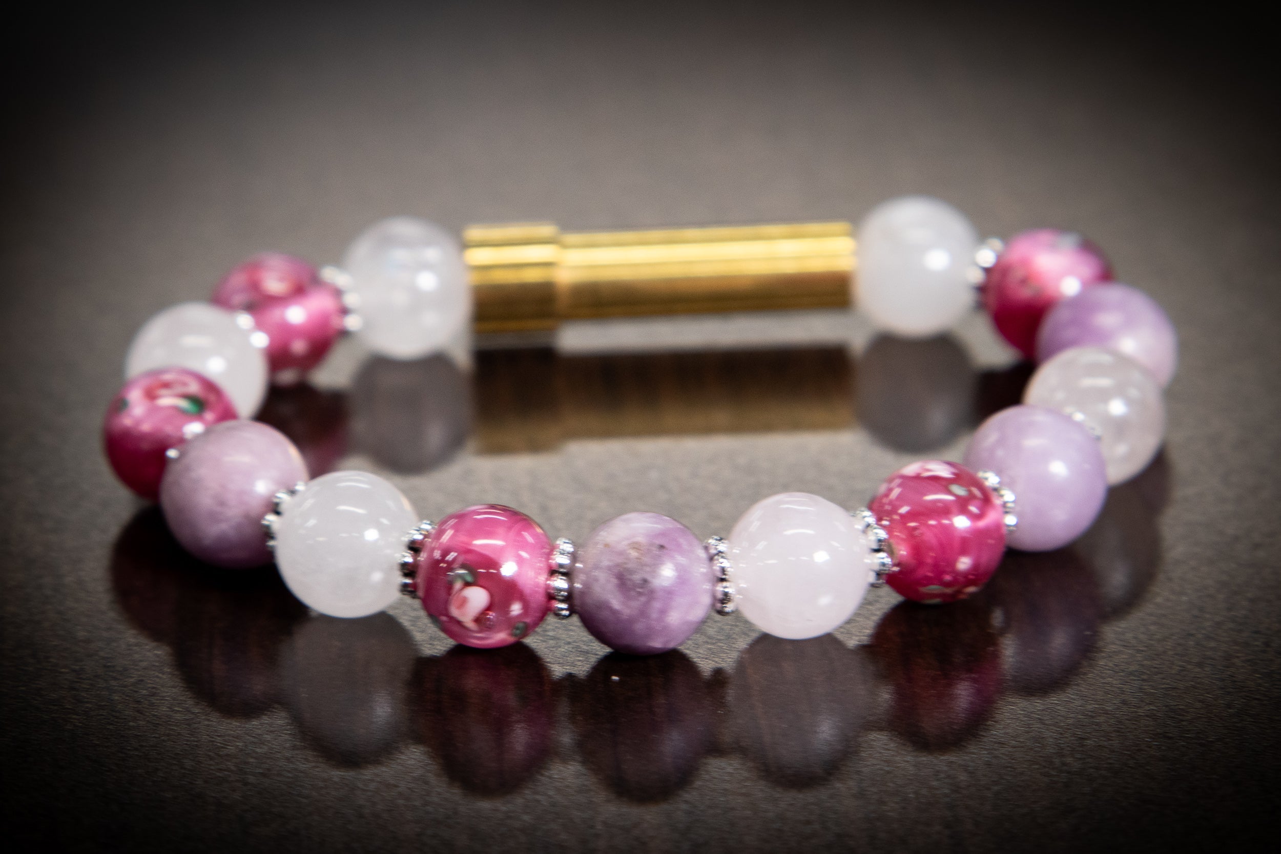 Silver cremation jewelry bracelet with snow quartz, kunzite, and pressed flowers, designed for hair, fur, or ashes.