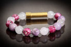 Silver cremation jewelry bracelet with snow quartz, kunzite, and pressed flowers, designed for hair, fur, or ashes.