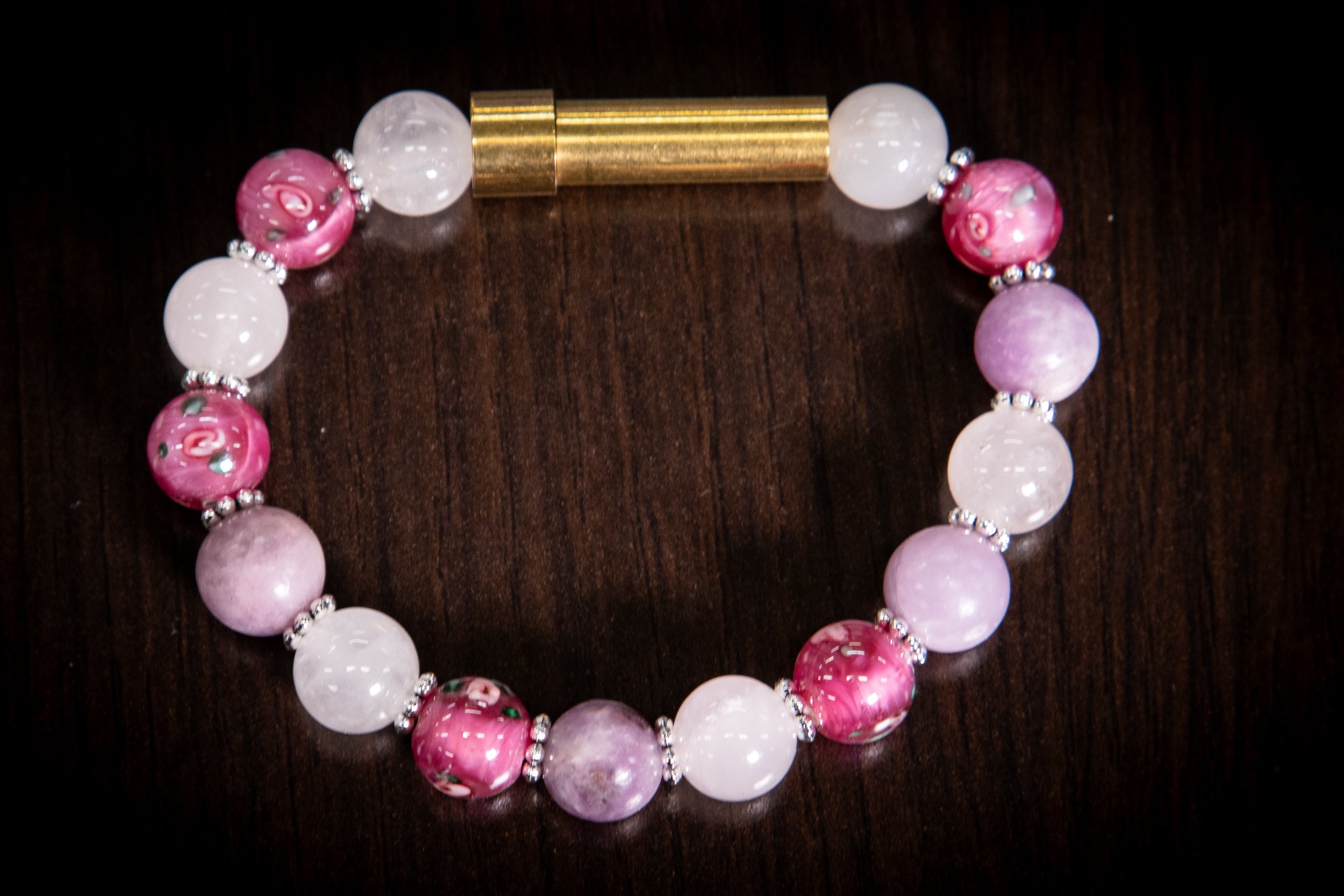 Silver cremation jewelry bracelet with snow quartz, kunzite, and pressed flowers, designed for hair, fur, or ash keepsakes.