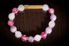 Silver cremation jewelry bracelet with snow quartz, kunzite, and pressed flowers, designed for hair, fur, or ash keepsakes.