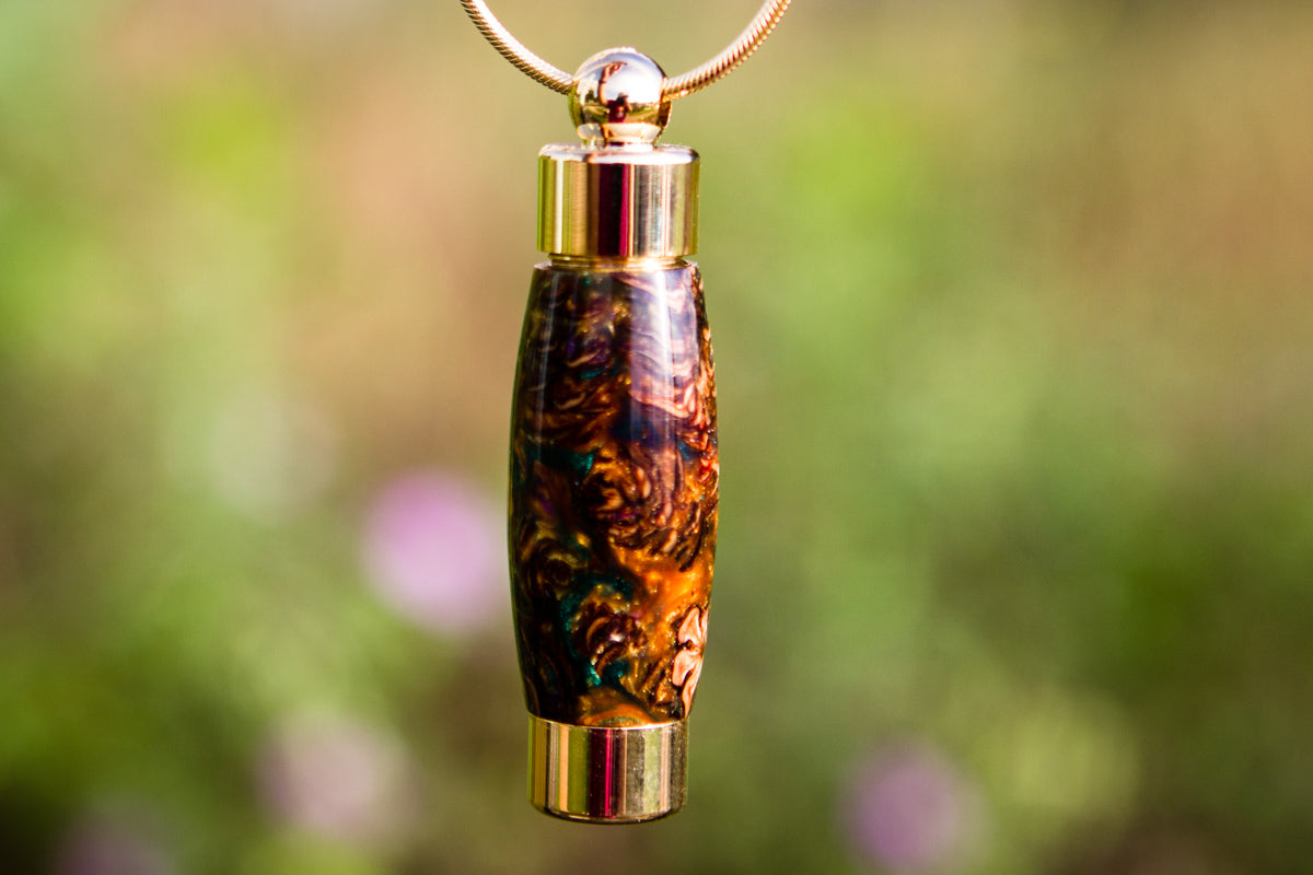 Brown pinecone keepsake urn pendant by Spirit Pieces, memorial pendant for cremation ash or hair, with a natural pinecone design.