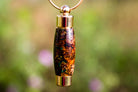 Brown pinecone keepsake urn pendant by Spirit Pieces, memorial pendant for cremation ash or hair, with a natural pinecone design.