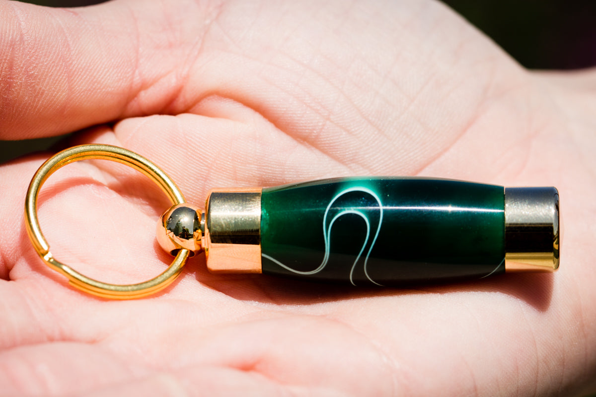 Emerald acrylic keepsake urn pendant for cremation ash or hair, memorial pendant by Spirit Pieces with secure closure.