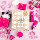 Spongellé Bulgarian Rose Daisy Body Gift Set with floral-scented body wash and exfoliating sponges, elegant gift packaging.