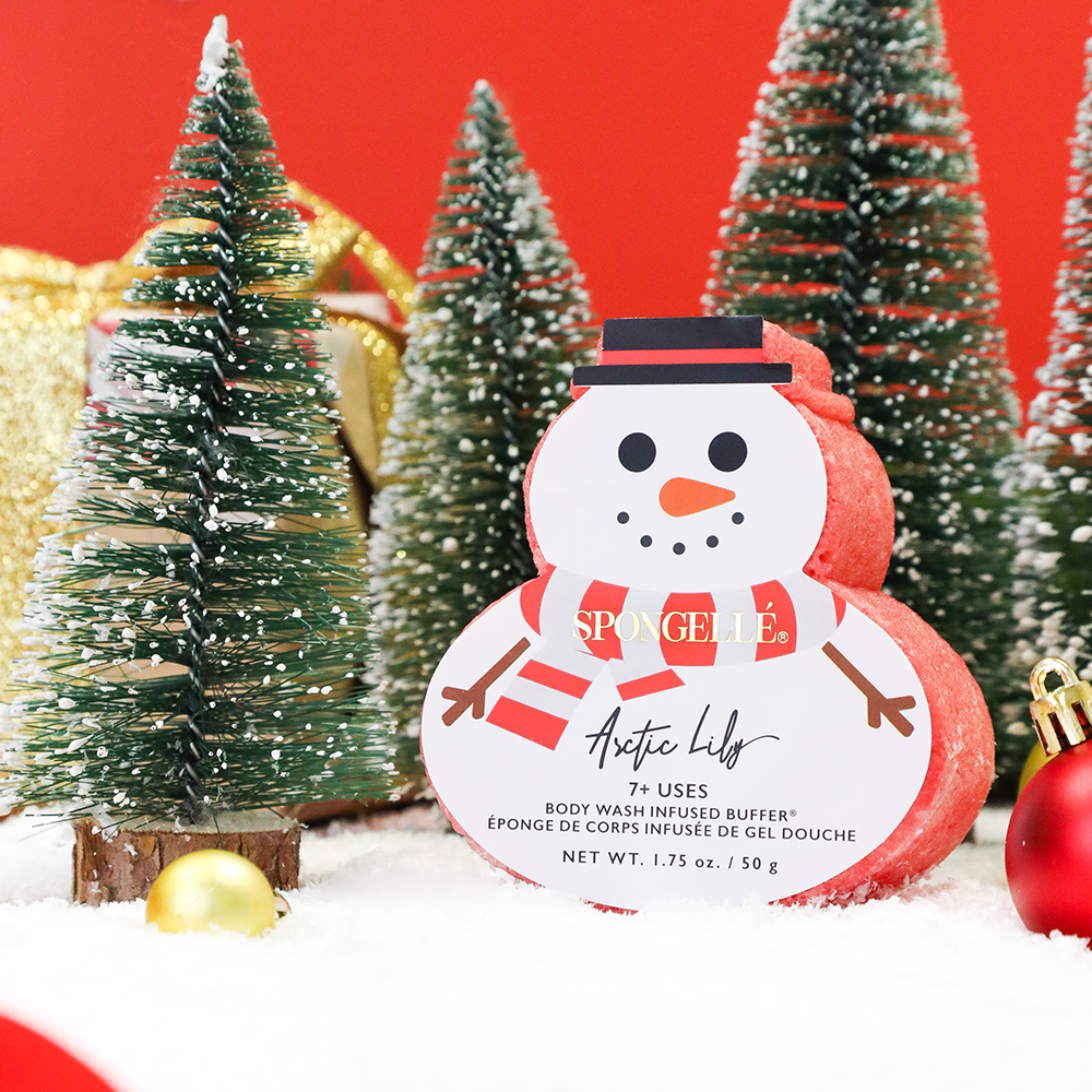 Spongellé Arctic Lily Holiday Snowman body wash infused buffer with floral and winter-themed design for gentle skin cleansing.