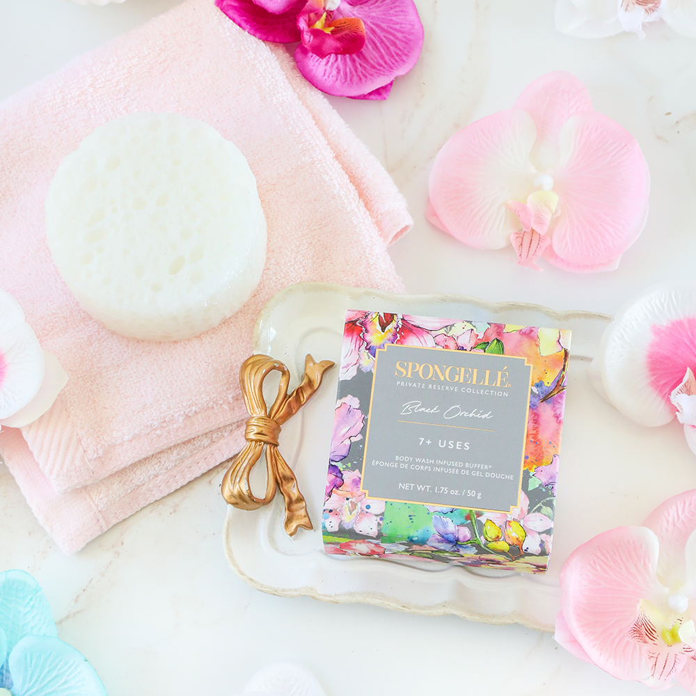 Black Orchid Spongette body wash infused buffer from Spongellé, featuring a soft, textured sponge for gentle cleansing.
