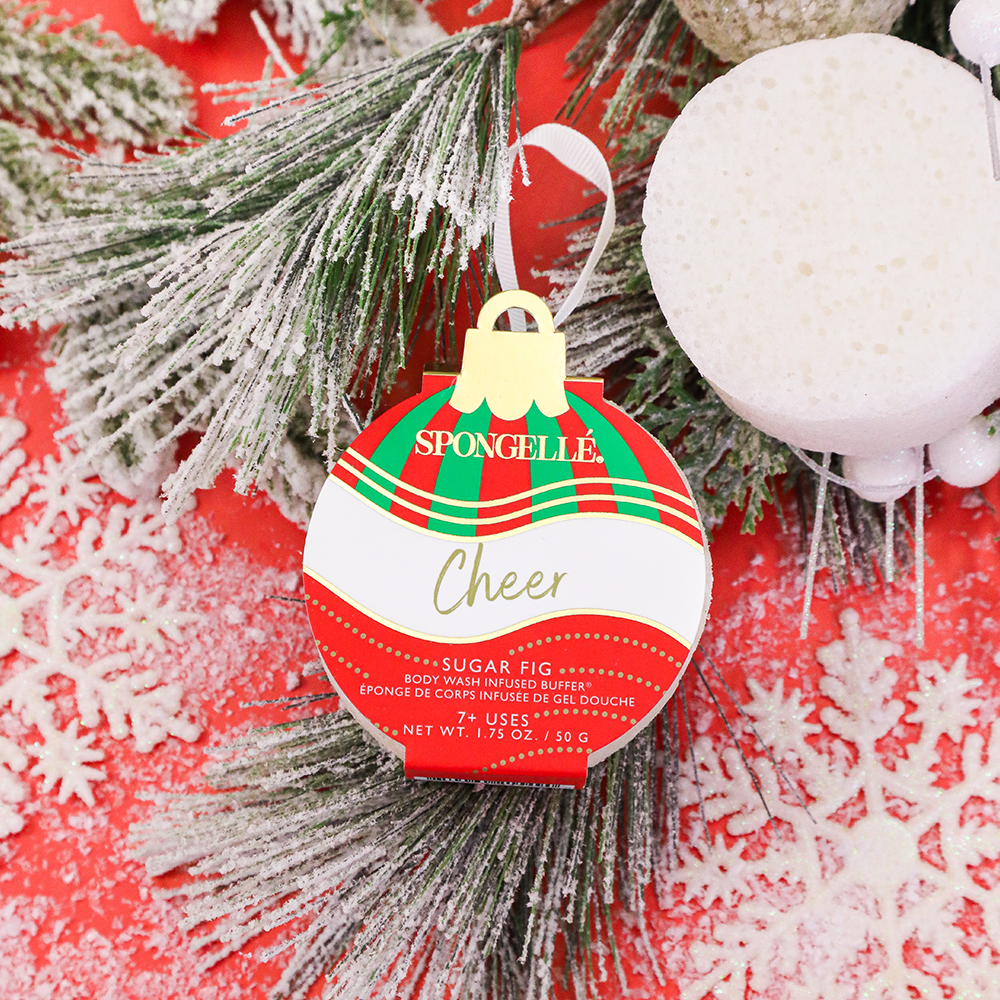 Spongellé Cheer Sugar Fig body wash infused buffer shaped like a holiday ornament with festive design and vibrant colors.
