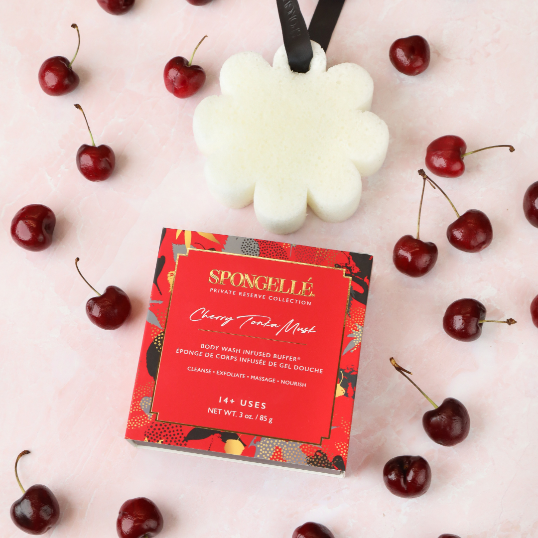 Spongellé Cherry Tonka Musk Body Wash Infused Buffer with boxed floral packaging, soft textured exfoliating body sponge.
