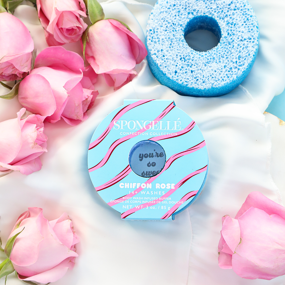 Spongellé Chiffon Rose body wash infused buffer with soft pink and white sponge featuring floral design and branding.