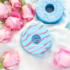 Spongellé Chiffon Rose body wash infused buffer with soft pink and white sponge featuring floral design and branding.