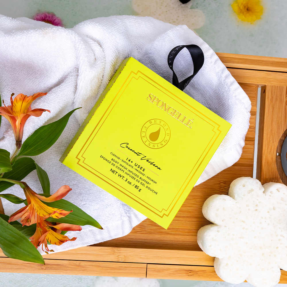 Spongellé Coconut Verbena Body Wash Infused Buffer in boxed flower packaging, soft sponge with floral design and coconut-verbena scent.