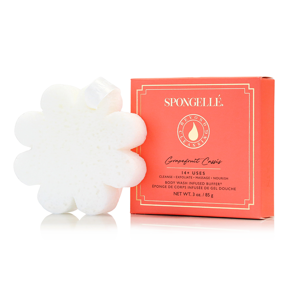 Spongellé Grapefruit Cassis body wash-infused buffer with boxed floral design, featuring a textured sponge for skincare and cleansing.
