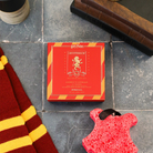 Gryffindor™ Godric's Courage Buffer by Spongellé, a Harry Potter™ Collection body wash infused buffer with a vibrant red design.