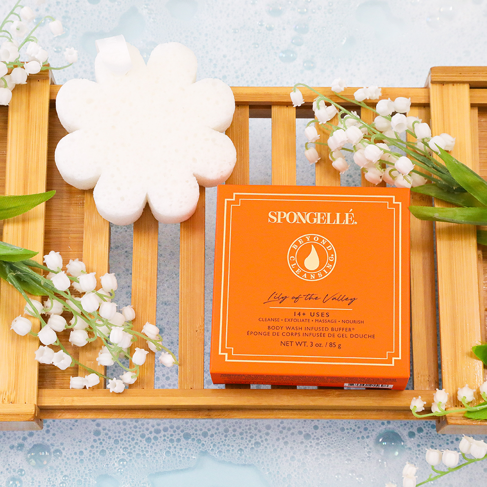 Spongellé Lily of the Valley body wash infused buffer with boxed floral design, soft sponge for skincare and cleansing.