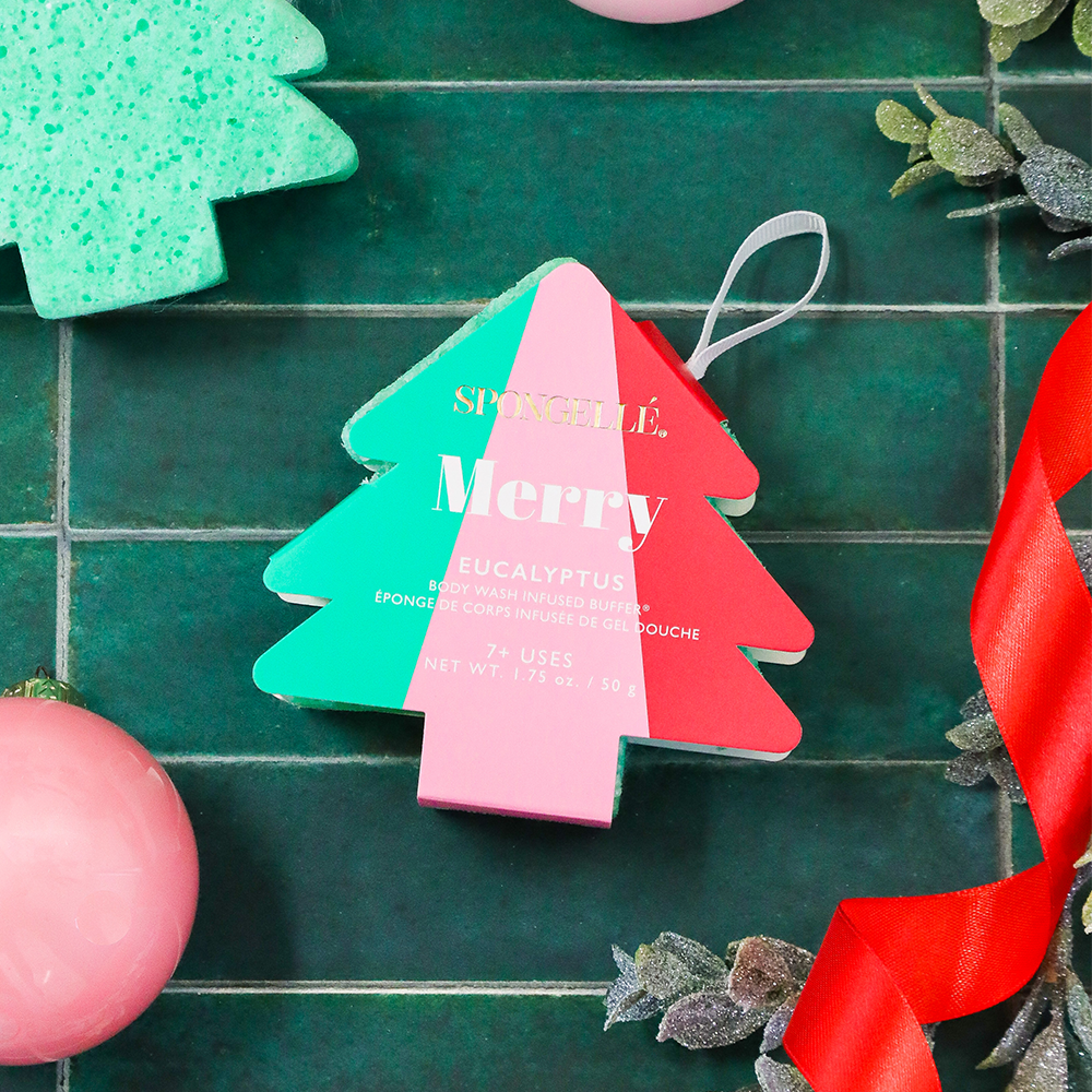 Spongellé Merry Eucalyptus Body Wash Infused Buffer with holiday tree design, featuring festive green eucalyptus scent.
