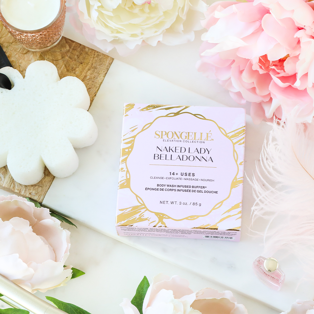 Spongellé Naked Lady Belladonna Body Wash Infused Buffer in boxed floral packaging with floral design and textured surface.