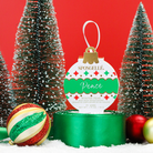Spongellé Peace Winter Pear Body Wash Infused Buffer as a holiday ornament with festive design and textured body wash buffer appearance.