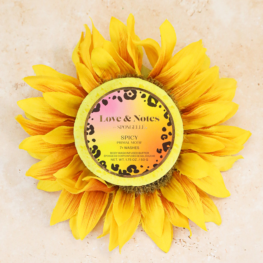 Spongellé Love & Notes Primal Motif body wash-infused buffer sponge with floral design and textured surface for gentle cleansing.