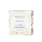 Spongellé Sego Lily Elevation Body Wash Infused Buffer with boxed flower design, showcasing a floral body care product.