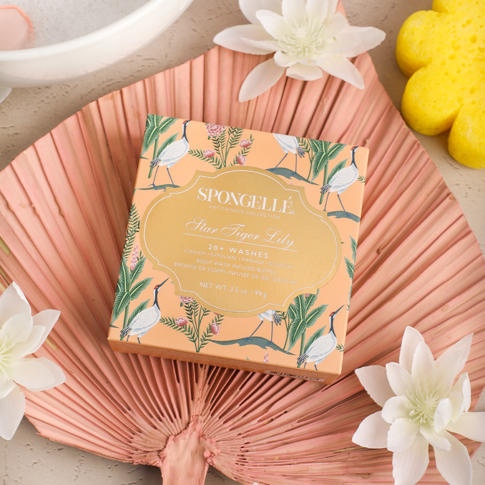 Spongellé Star Tiger Lily Body Wash Infused Buffer with floral design and textured surface for gentle exfoliation and cleansing.