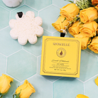 Spongellé Sweet Patchouli Body Wash Infused Buffer in boxed flower packaging, soft exfoliating buffer with floral scent.