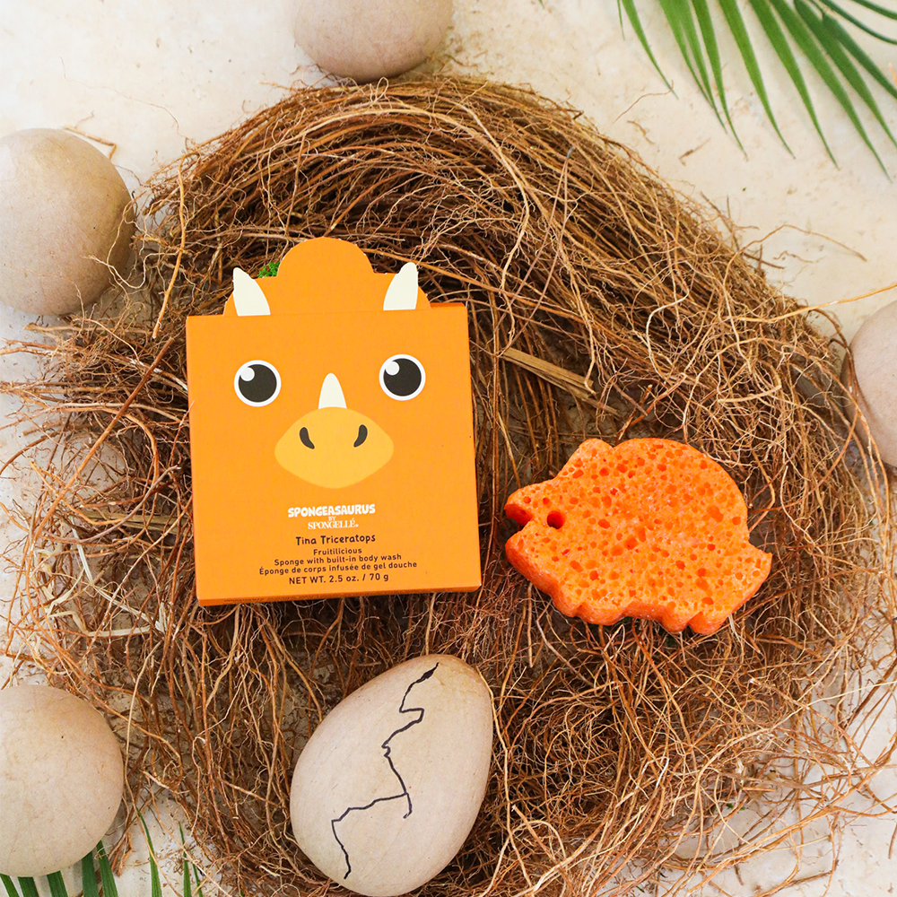 Tina Triceratops Spongeasaurus dinosaur-shaped body wash infused buffer by Spongellé, soft textured for gentle cleansing.