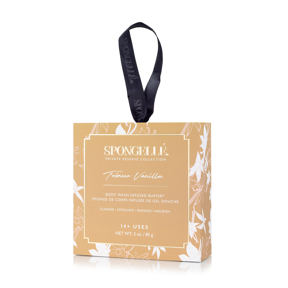 Spongellé Tobacco Vanilla Body Wash Infused Buffer in boxed flower packaging, soft textured exfoliating buffer for skin.