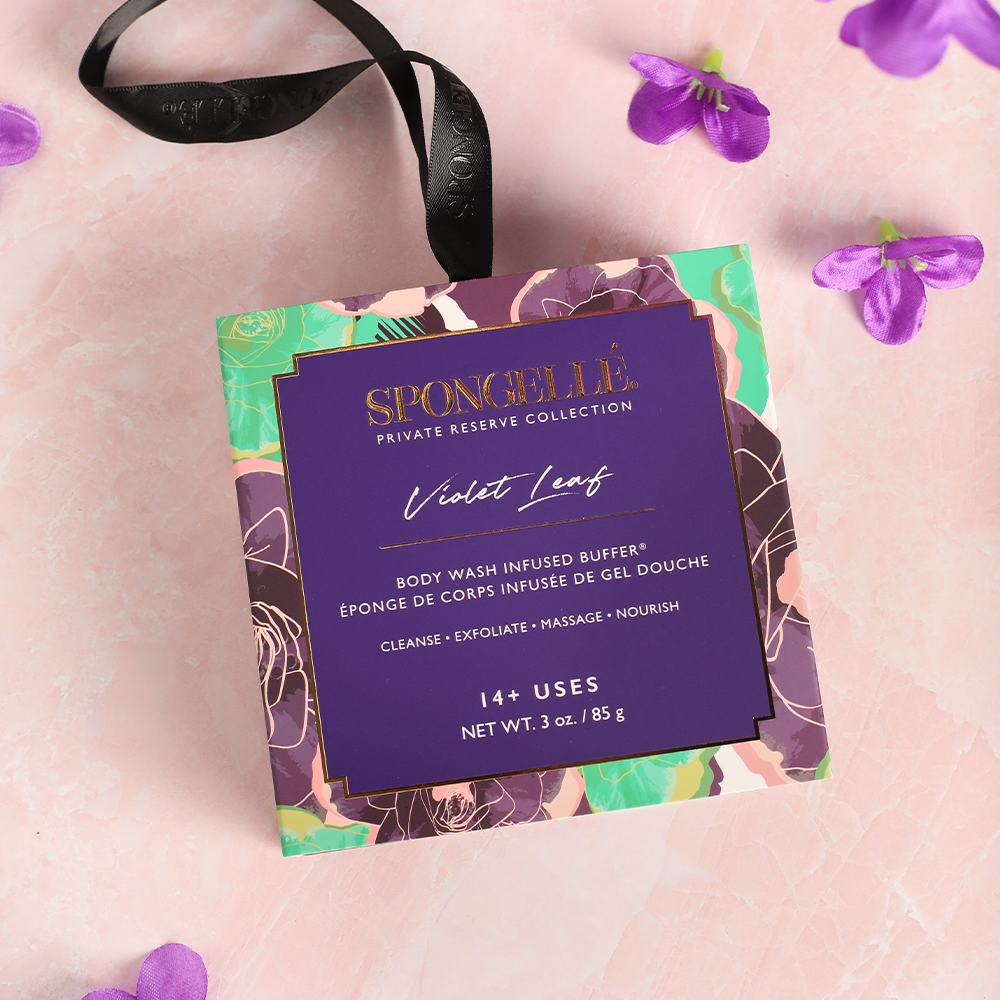 Spongellé Violet Leaf Body Wash Infused Buffer with boxed violet flower design, soft texture and floral scent.
