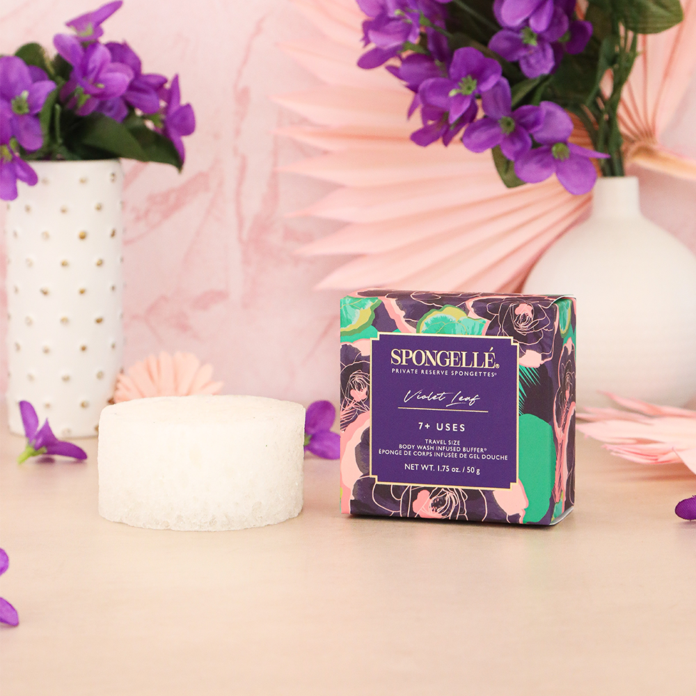 Violet Leaf Spongette body wash infused buffer by Spongellé, showing a colorful sponge with botanical violet leaf design.