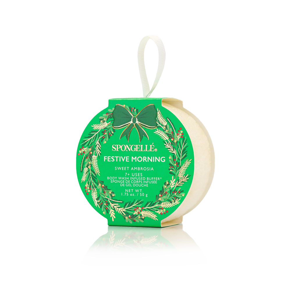 Spongellé Warmth & Wonder holiday wreath body wash infused buffer with festive design and luxurious exfoliating texture.