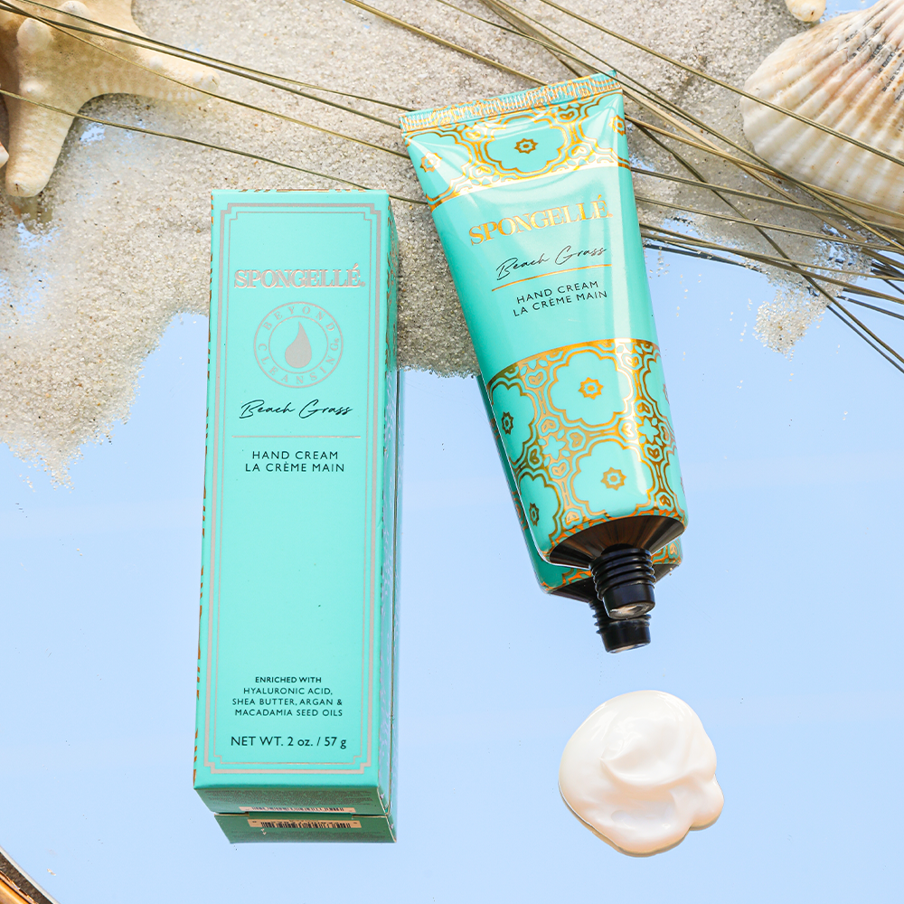Spongellé Beach Grass hand cream tube with floral and beach-inspired design, featuring soft, nourishing hand moisturizer.