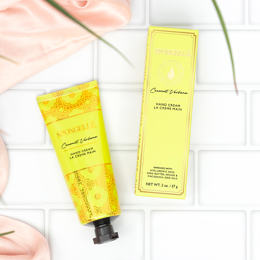 Spongellé Coconut Verbena hand cream in a sleek tube, featuring tropical coconut and floral verbena scent for nourishing hands.