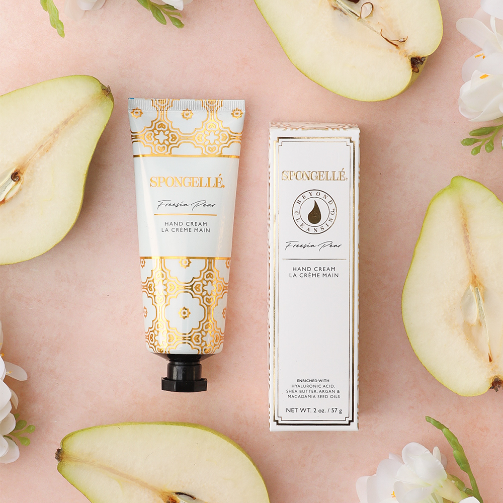 Spongellé Freesia Pear hand cream tube with floral design, featuring a floral scent and creamy texture for nourishing hands.