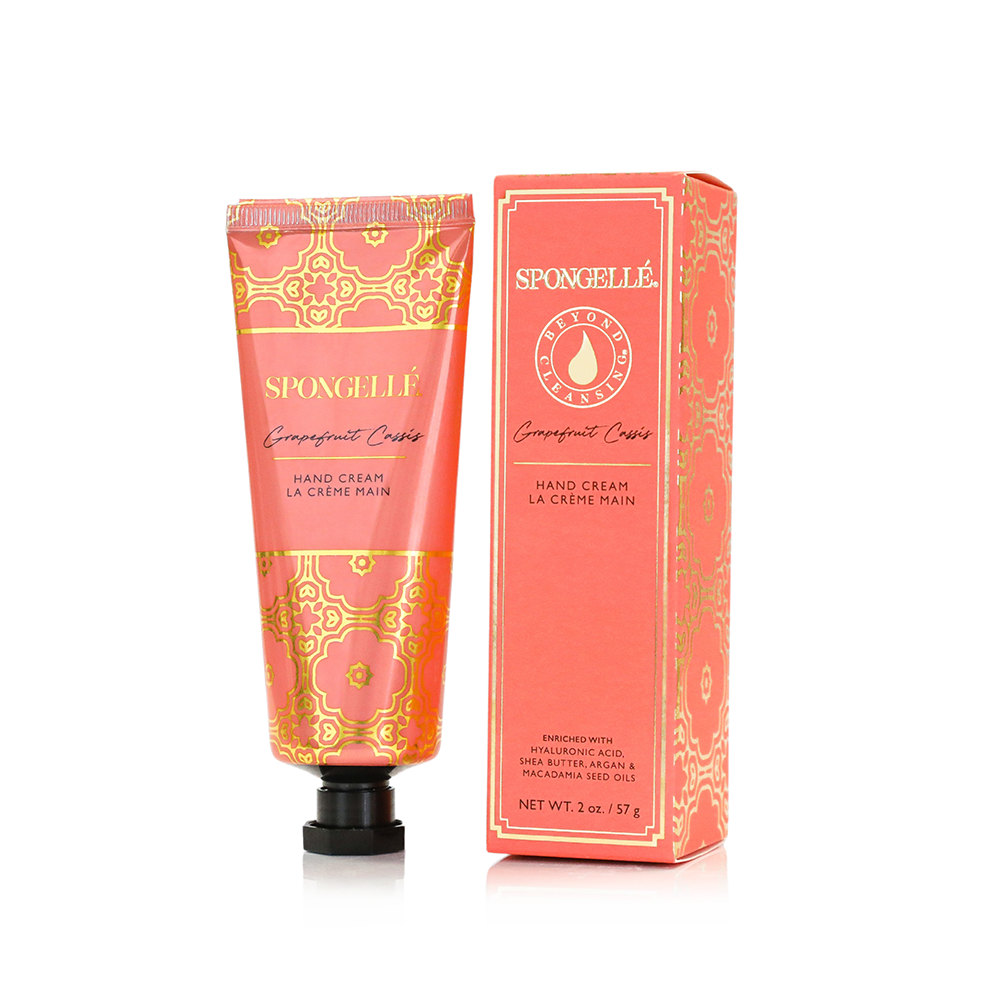 Spongellé Grapefruit Cassis hand cream tube with floral and citrus design, showcasing creamy texture and branding.