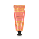 Spongellé Grapefruit Cassis hand cream tube with floral design, featuring bright orange and purple accents, on a white background.