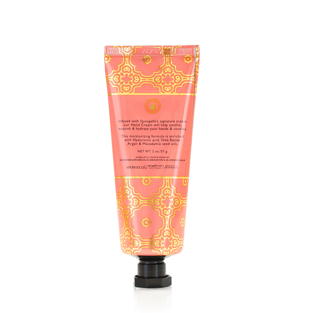 Spongellé Grapefruit Cassis hand cream tube showing floral design and product label with citrus and berry scent branding.