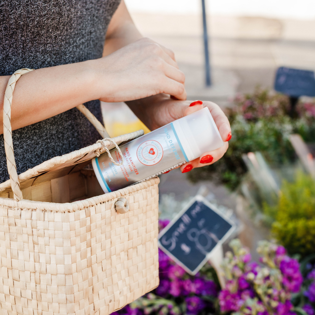 Spongellé Hand Defense Sanitizer in a clear bottle with a pump, designed for hand sanitization and skin protection.