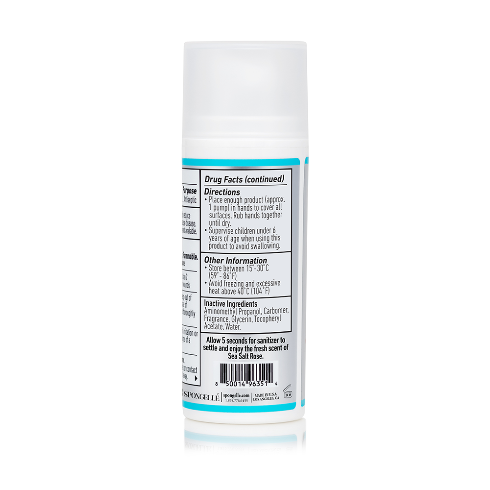 Spongellé Hand Defense Sanitizer bottle with pump, clear liquid sanitizer for hand cleaning and protection.