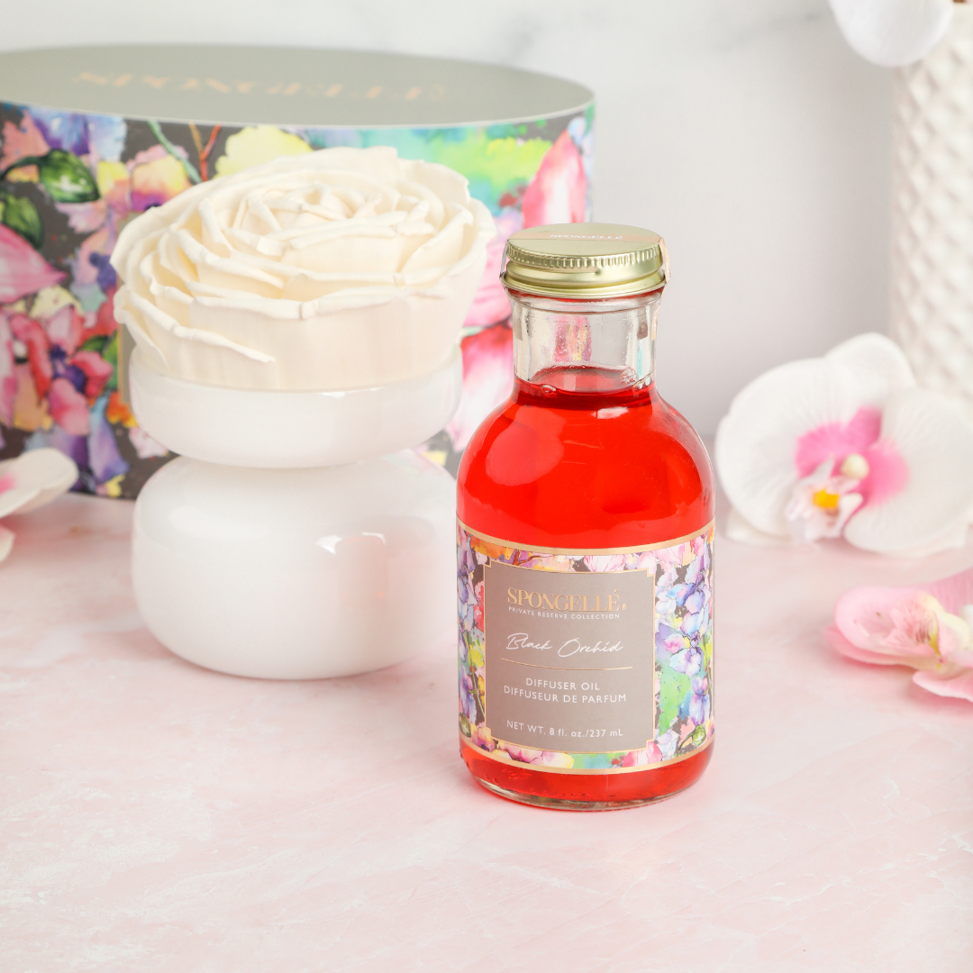 Black Orchid Private Reserve diffuser by Spongellé, a home fragrance with a sleek black bottle and elegant design.