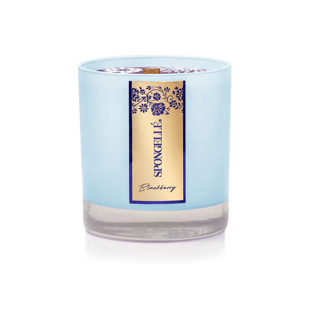Blackberry Private Reserve Candle by Spongellé, elegant home fragrance with a black and gold container and a lit wick.