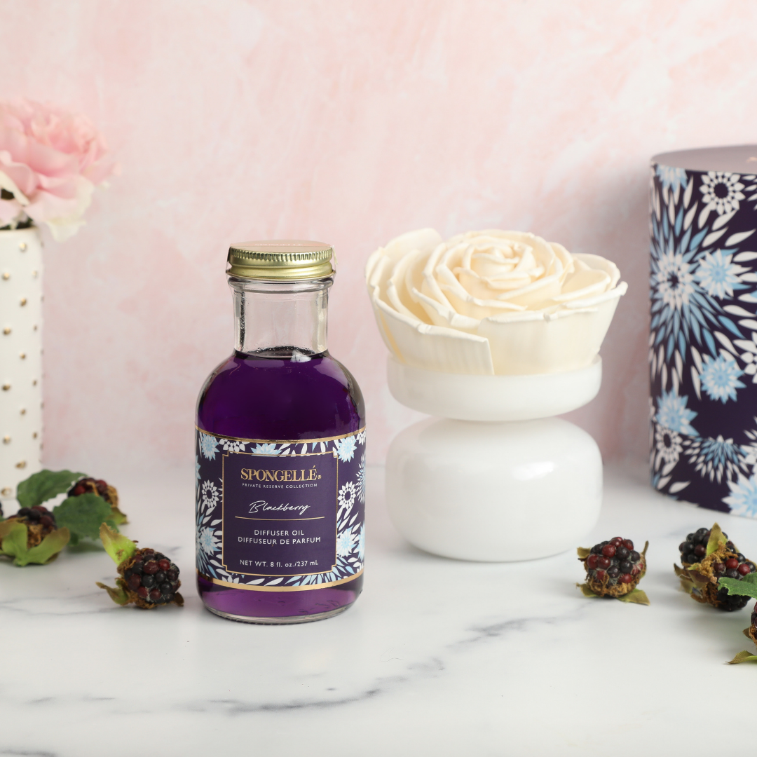 Blackberry Private Reserve diffuser by Spongellé, a home fragrance with a sleek glass bottle and reed sticks for aromatic scent.